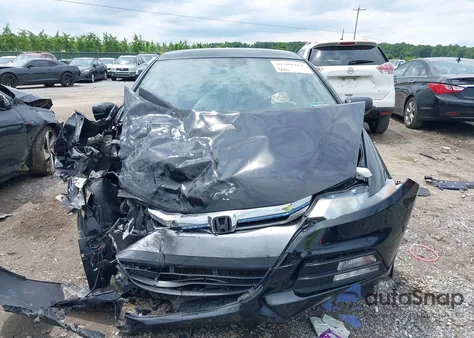 2012 Honda Insight from USA, damaged, VIN JHMZE2H36CS000448